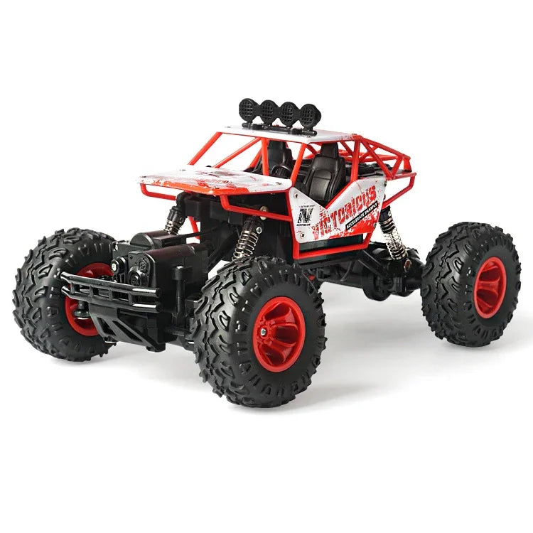 Red and black remote control off-road truck toy with large tires and rugged suspension